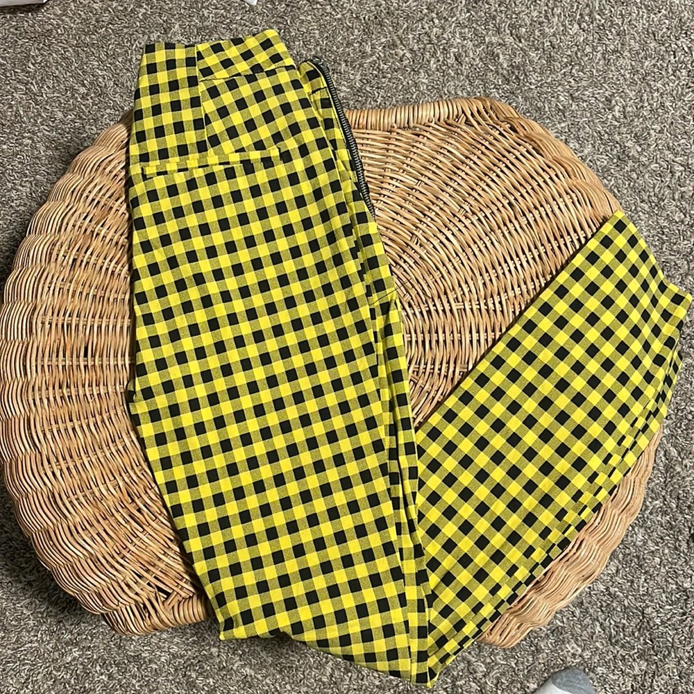 Woman’s black and yellow striped pants